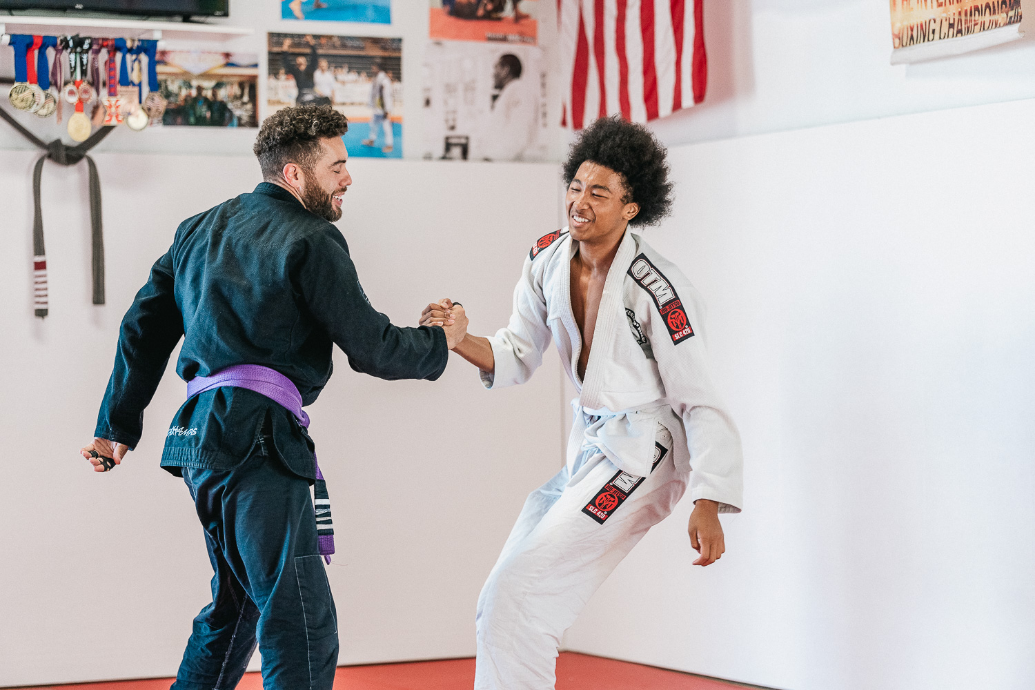 Students practicing BJJ techniques