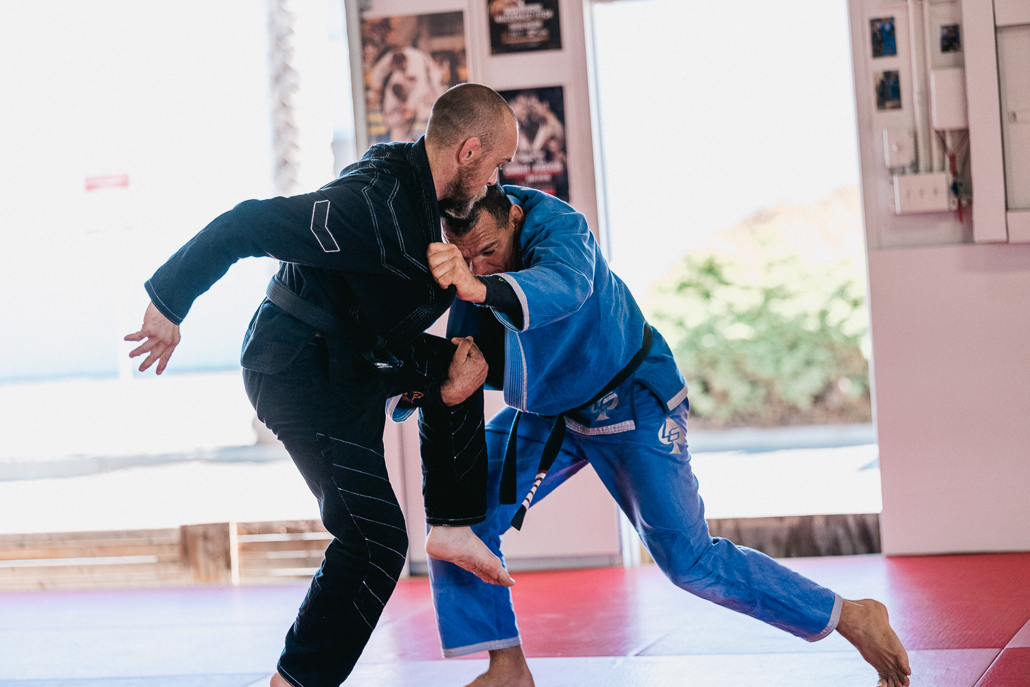 Students practicing BJJ techniques