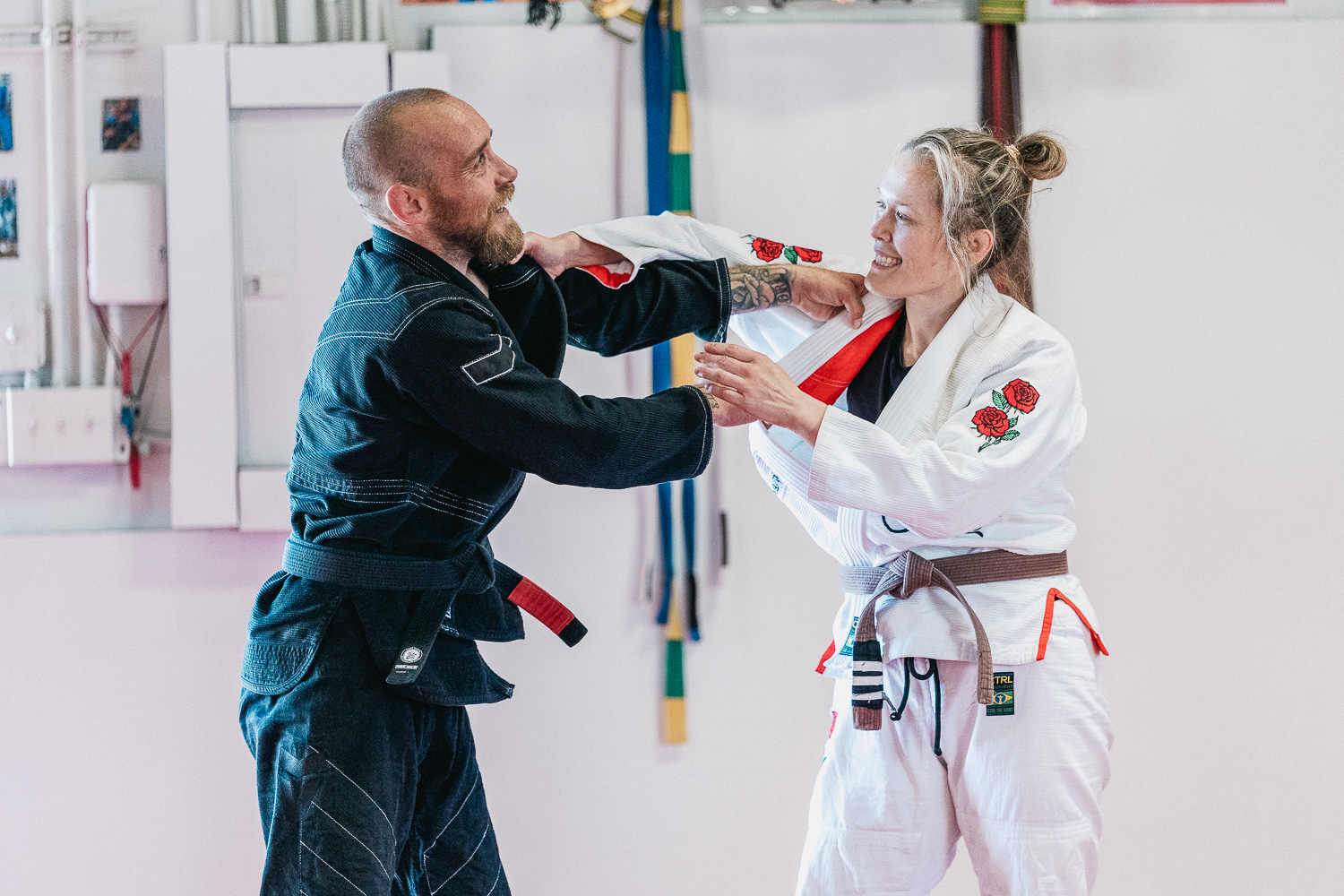 Students practicing BJJ techniques