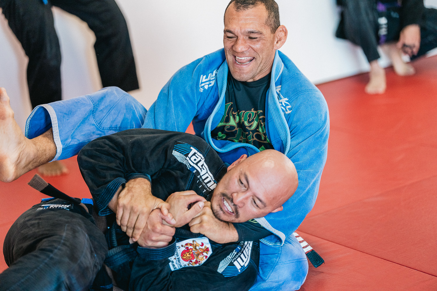 Students practicing BJJ techniques