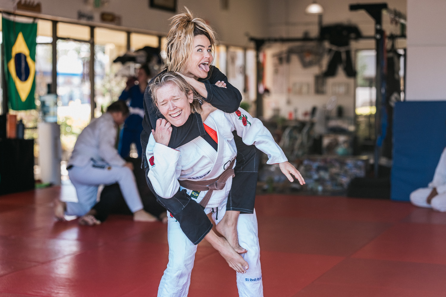 Students practicing BJJ techniques